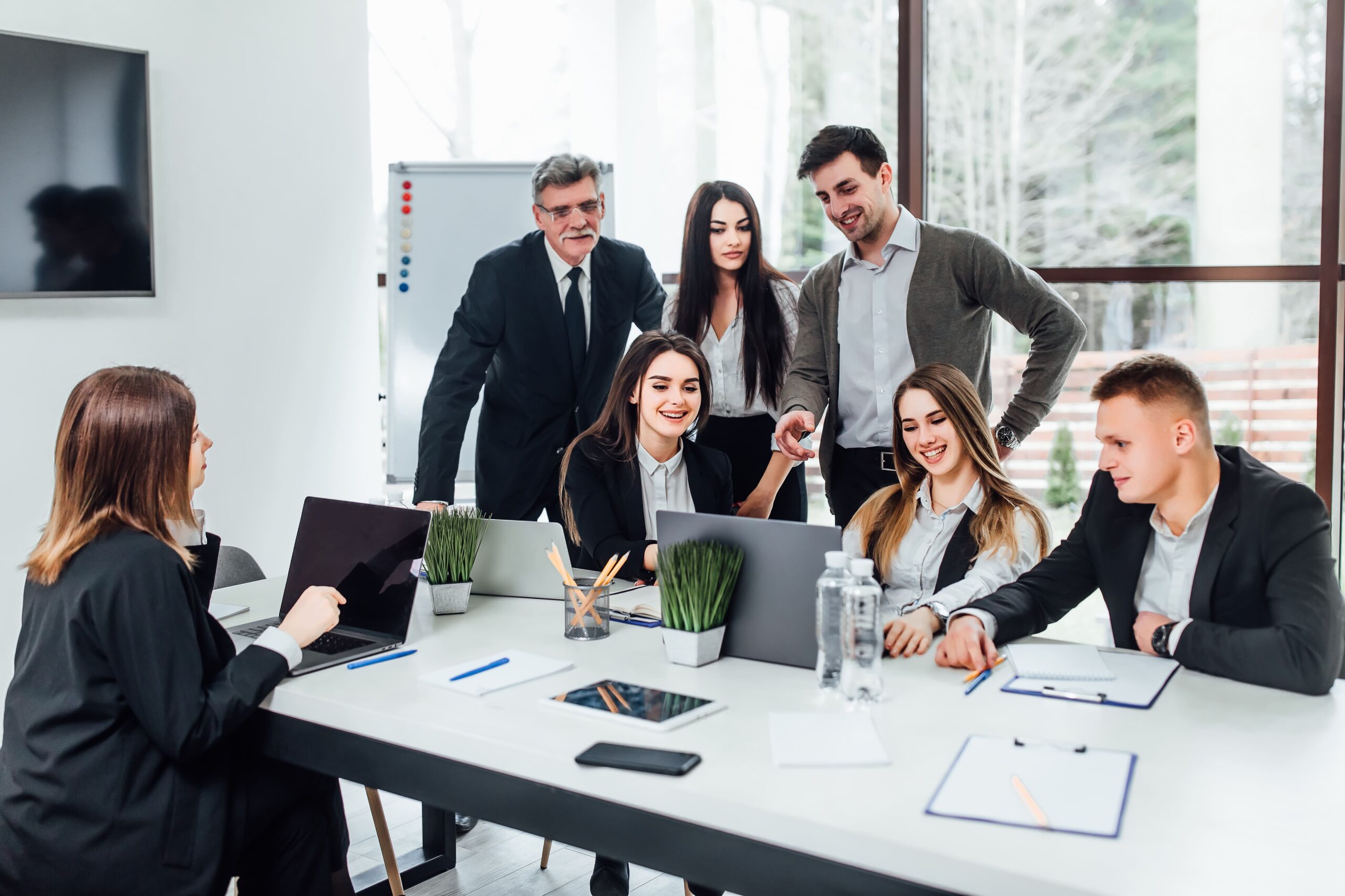 staff-meeting-group-young-modern-people-smart-casual-wear-discussing-something-while-working-creative-office-business-time (1)
